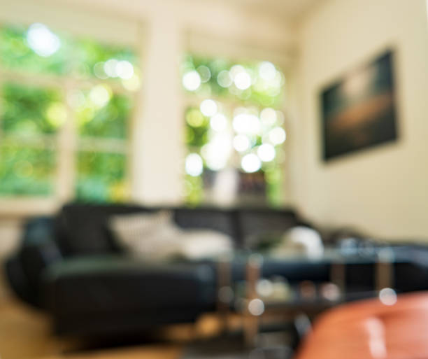 istock Blurred Living room with great windows in an old building 1018237486