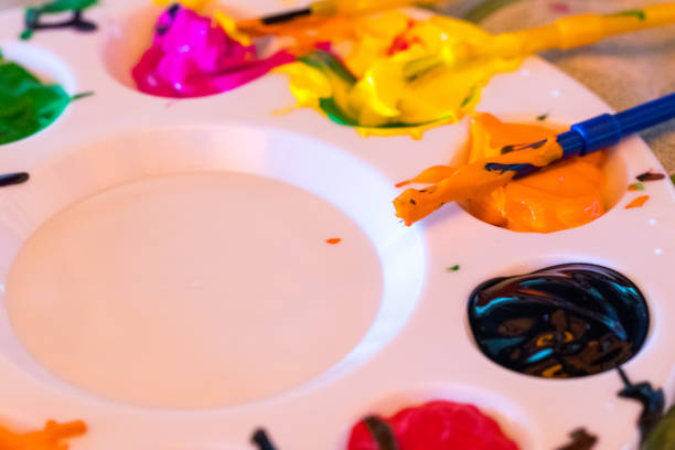 istock art palette with paint color and paint brushes close-up 1018237730