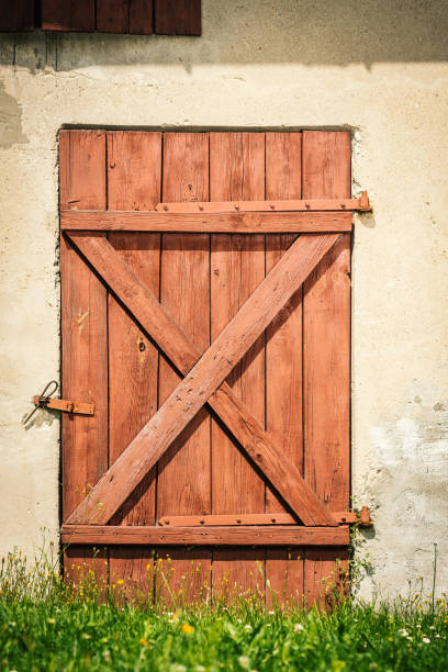 istock old brown wooden door from a concrete barn 1018242406