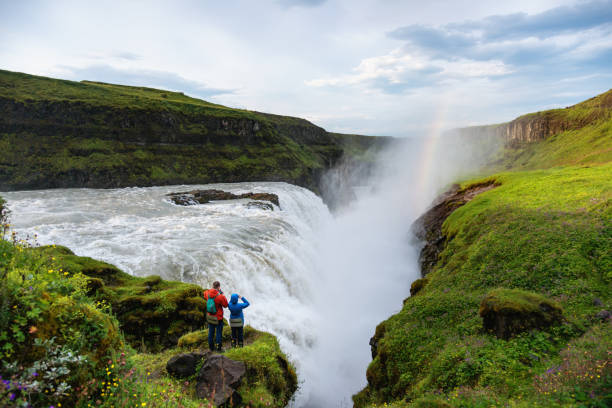 istock Couple traveling in Iceland, Gullfoss waterfall 1018252032