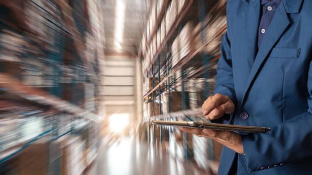 istock Businessman manager using tablet check and control for workers with Modern Trade warehouse logistics. Industry 4.0 concept 1018266936