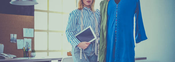 istock Fashion designer working on her designs in the studio 1018267060