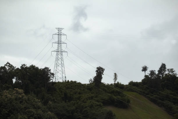 istock High-voltage pylons on the mountain road. 1018272292