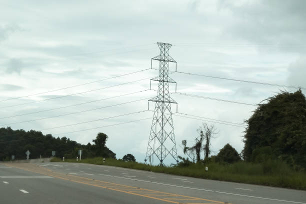 istock High-voltage pylons on the mountain road. 1018273602
