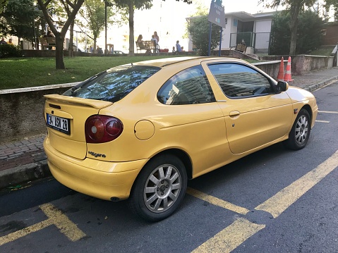 Renault Yellow Sports parking in the street