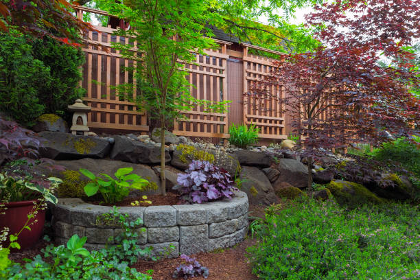 Home garden backyard landscaping with natural and stone stacked planter Home garden backyard landscaping with natural and stone stacked planter pots trellis lantern trees shrubs plants hardscape photos stock pictures, royalty-free photos & images