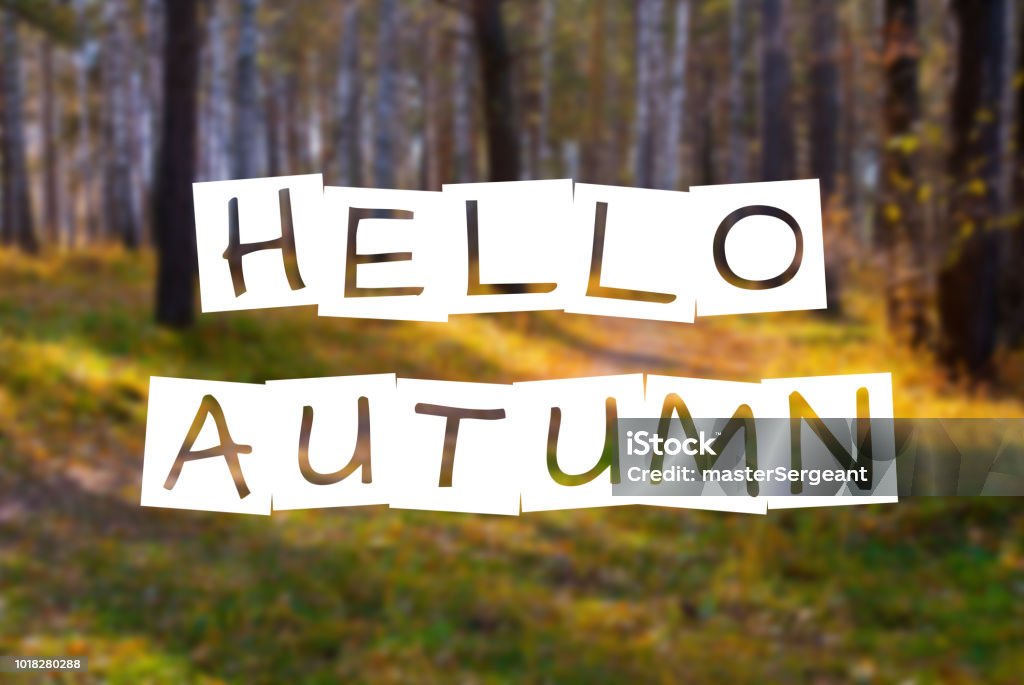 hello autumn, text over blurred wild fall forest Autumn Stock Photo