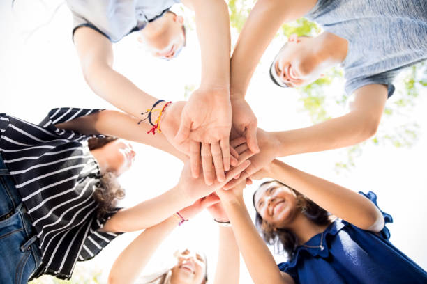 istock Friends putting hands together 1018281944