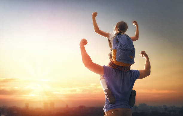 istock Man and girl with backpack 1018282552
