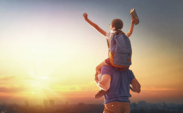 istock Man and girl with backpack 1018282556