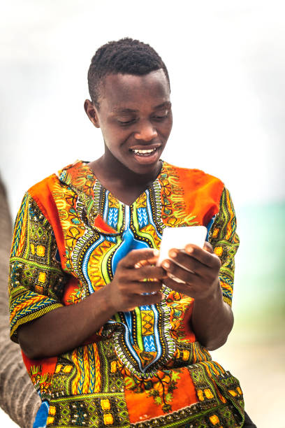 istock African Teenage boy using smart phone 1018286420