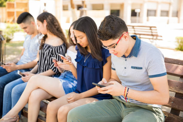 istock Teens social networking outdoors 1018287420