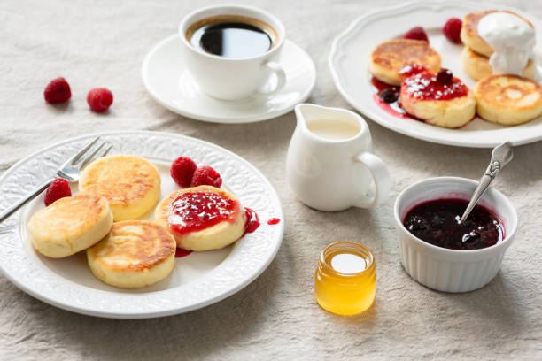 istock Cottage cheese pancakes with jam, honey and sour cream 1018289952