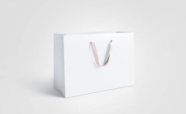 istock Blank white paper bag with silk handle mockup, isolated 1018290082