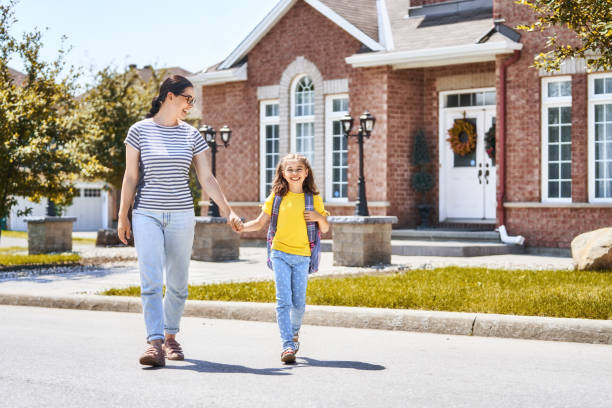 istock Parent and pupil go to school 1018291174
