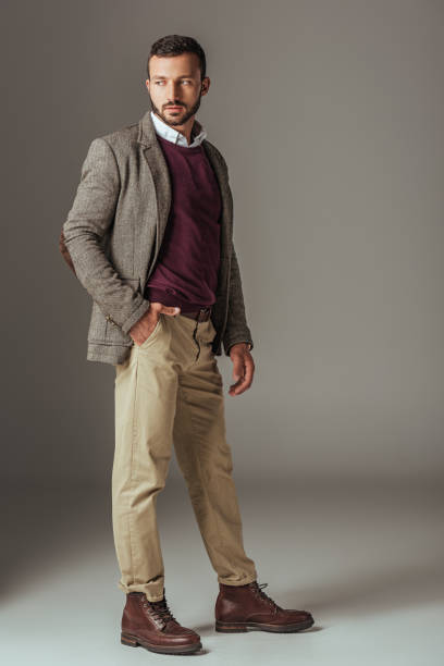 istock bearded man posing in stylish autumn tweed jacket, on grey 1018293426
