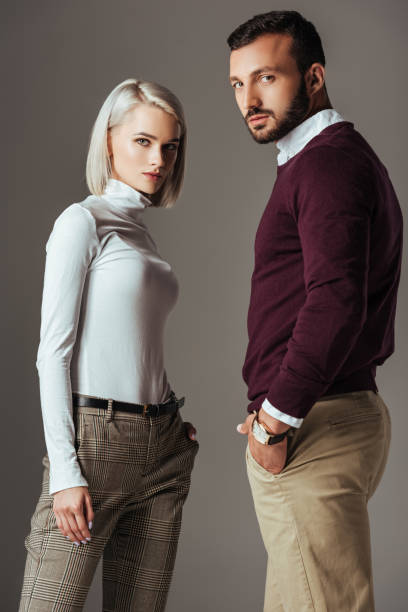 istock elegant couple posing in autumn outfit, isolated on grey 1018293464