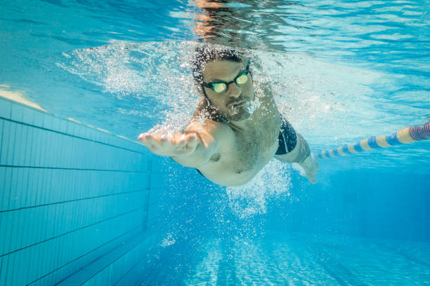 istock Pro freestyle swimmer under water 1018301918