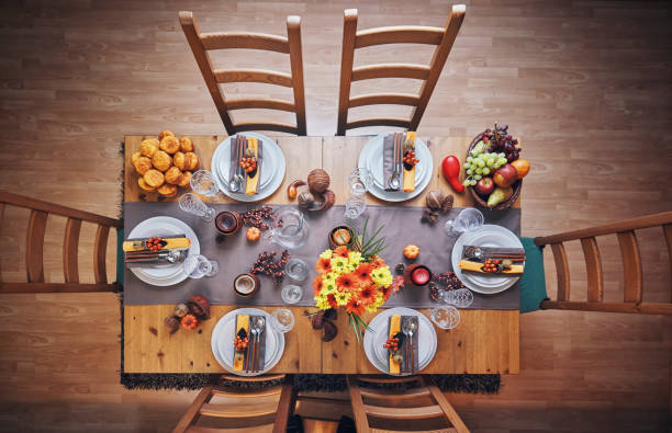 istock Decorated Table for Thanksgiving Dinner with Candles, Pumpkins, Leafs and Nuts 1018301938