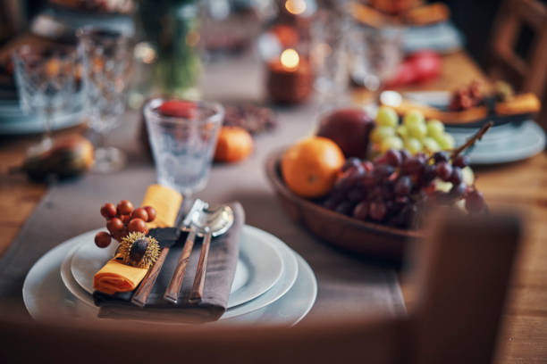 istock Decorated Table for Thanksgiving Dinner with Candles, Pumpkins, Leafs and Nuts 1018301964