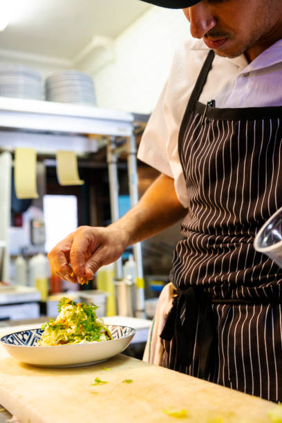 istock Mexican chef working in an authentic Mexican restaurant 1018305822