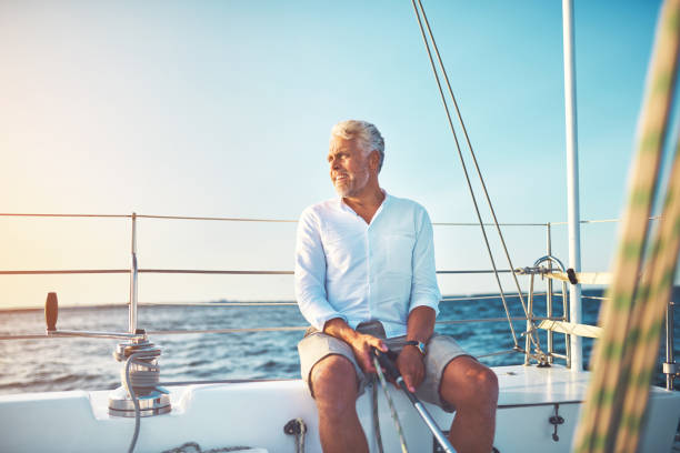 istock Mature man out for a sail on the open ocean 1018306070