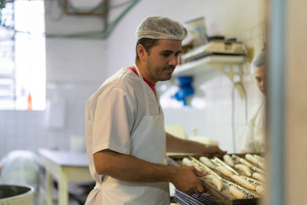 istock Bakers working in the professional kitchen at Bakery 1018315562