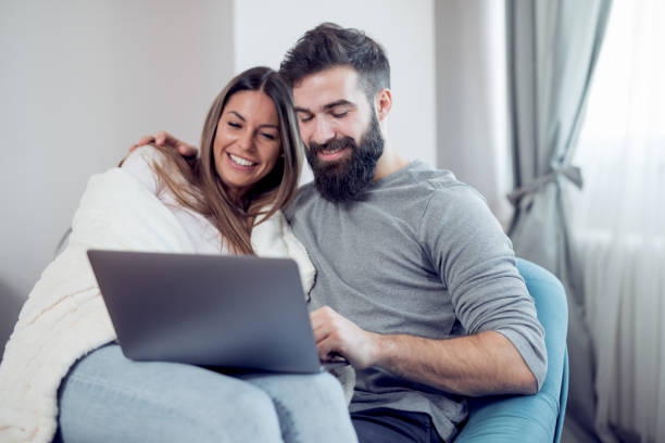 istock Couple relaxing at home together 1018322810