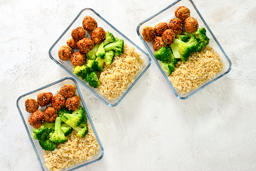 Meatballs and broccoli and rice lunch boxes cooked in advance and ready to be frozen or to be served for lunch, view from above