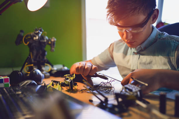 istock The kid loves to fix things.has a passion for electronics. 1018347446