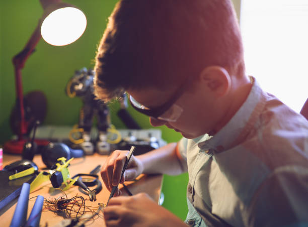 istock The kid loves to fix things.has a passion for electronics. 1018350876