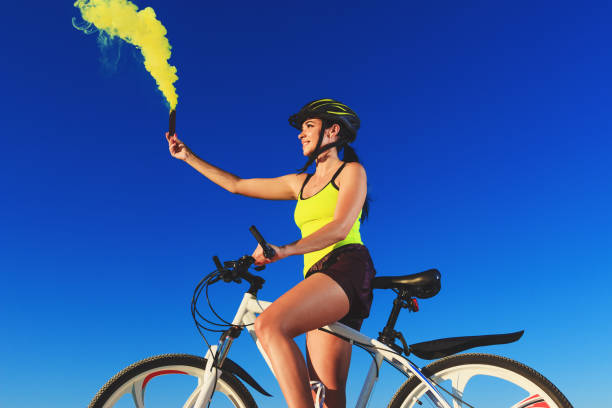 istock Woman on a bicycle against the blue sky 1018351592