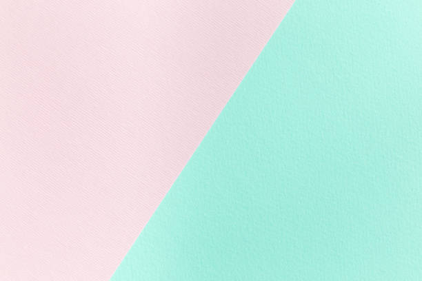 istock Pink and mint green paper texture, diagonal devided, blank background for template, horizontal, copy space 1018351856