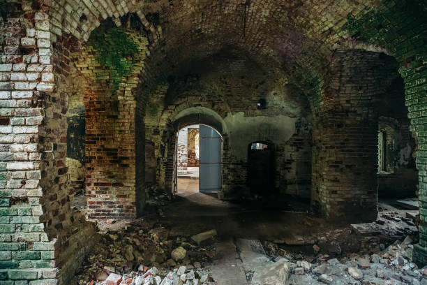 istock Inside ancient ruined medieval brick temple interior with arches and corridors 1018355514