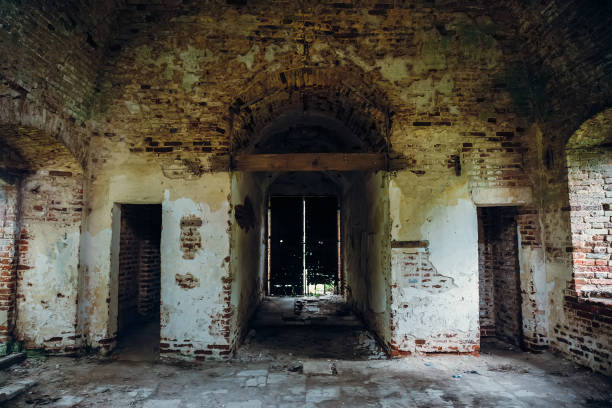 Inside ancient ruined medieval brick temple interior with arches and corridors