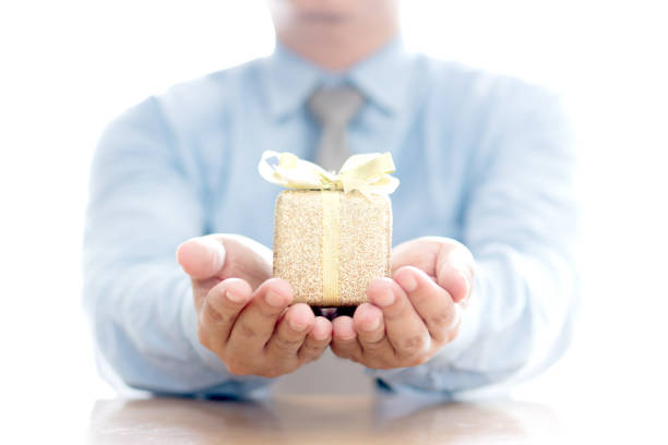 Close up of man with blue present box