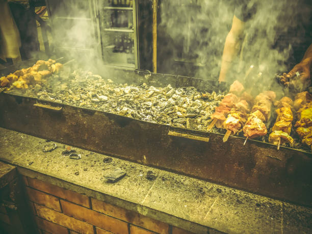 istock Marinated shashlik preparing on a barbecue grill over charcoal. Roasted stacked meat Shish kebab popular in Goergia. Traditional cuisine in Georgia 1018365340
