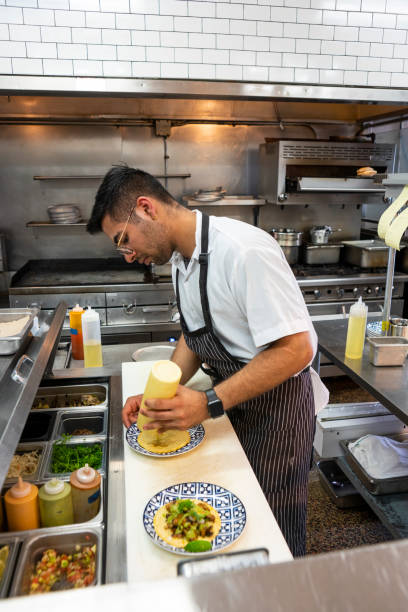 istock Mexican chef working in an authentic Mexican restaurant 1018366024