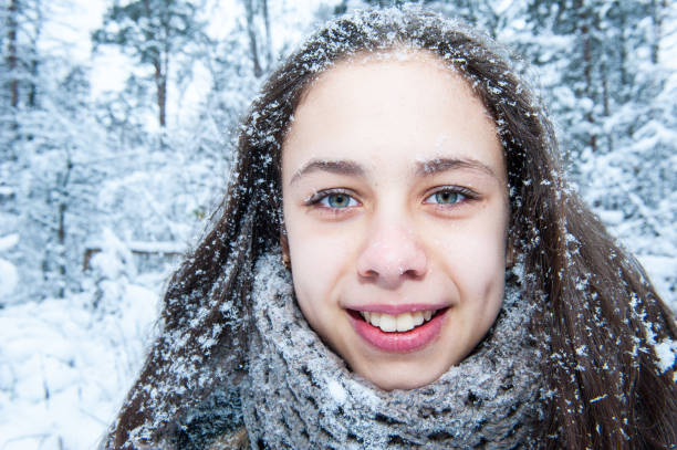 istock Girl in the winter forest 1018378190