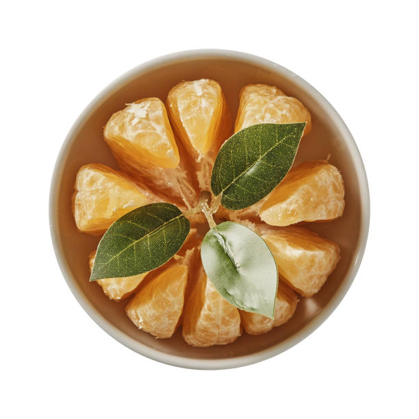 istock Tangerine on bowl. Preparing ingredients for cooking. Isolated on white background. Top view. 1018378312