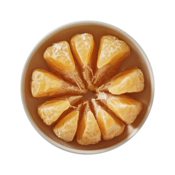 istock Tangerine on bowl. Preparing ingredients for cooking. Isolated on white background. Top view. 1018378320