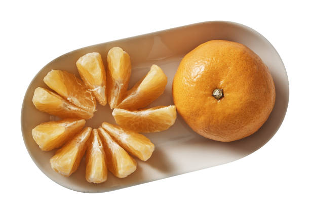 istock Tangerine on plate. Preparing ingredients for cooking. Isolated on white background. Top view. 1018378488