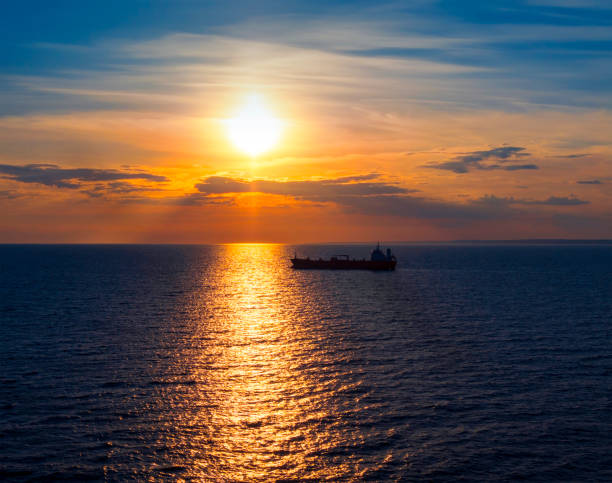istock Sunset with cargo ship in the Gulf of Finland 1018384676