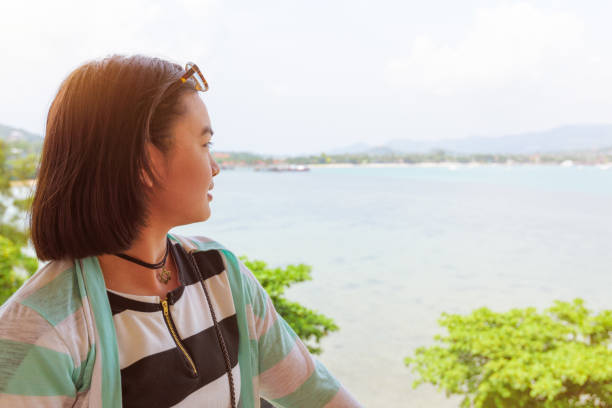 istock Woman looking at the sea 1018384714