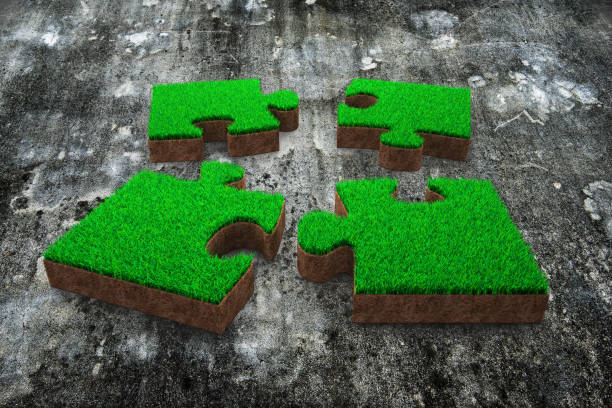 istock Four jigsaw puzzles with green grass red soil 1018386972