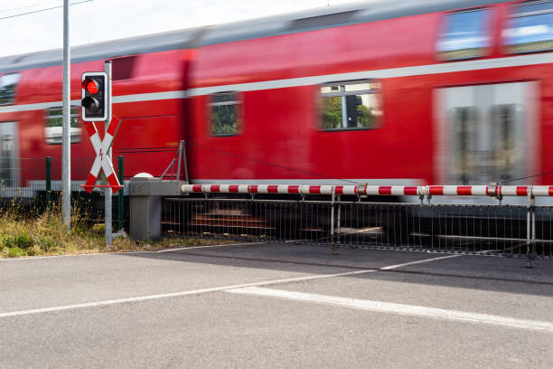 a modern intercity train go through a railway crossing