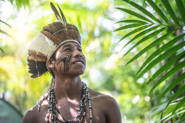 Indigenous Brazilian Young Man Portrait from Guarani Ethnicity Beautiful shooting of how Brazilian Native lives in Brazil Sustainable Lifestyle amazonas state brazil photos stock pictures, royalty-free photos & images