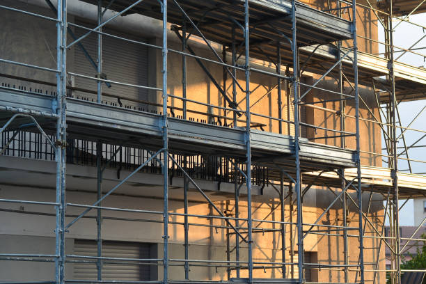 istock the scaffolding on a building to renovate it 1018409718