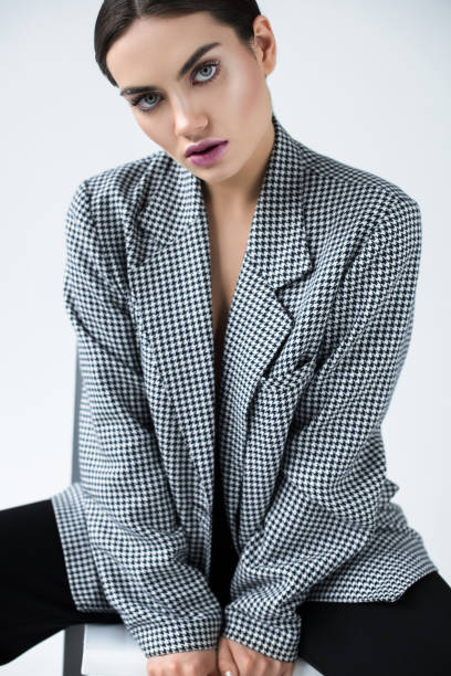 istock attractive girl posing in vintage elegant jacket, isolated on grey 1018410206