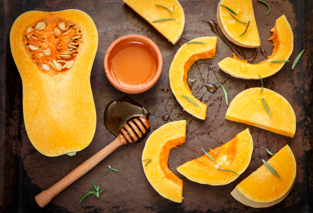istock Sliced raw organic butternut squash on a baking pan with honey and rosemary 1018410498